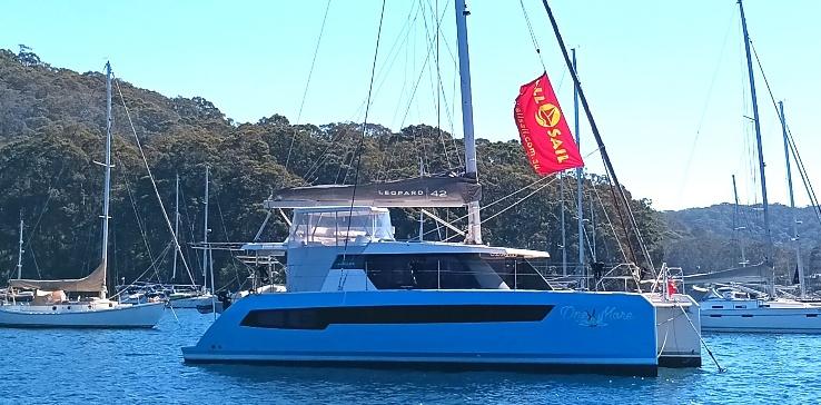 One More, the Leopard 42 catamaran, moored on Pittwater with an Allsail flag